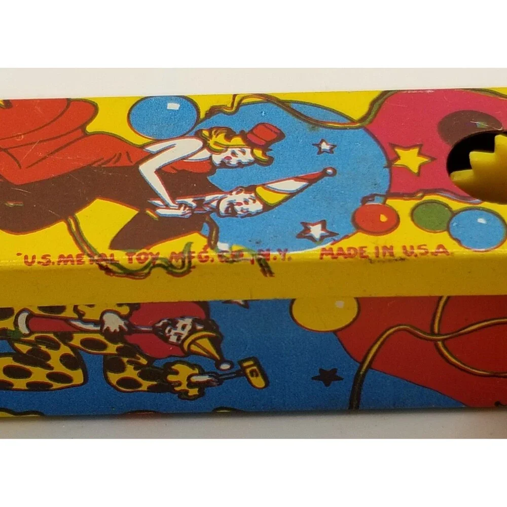 vintage tin lithograph ratchet style US Metal Toy Co noisemaker party theme